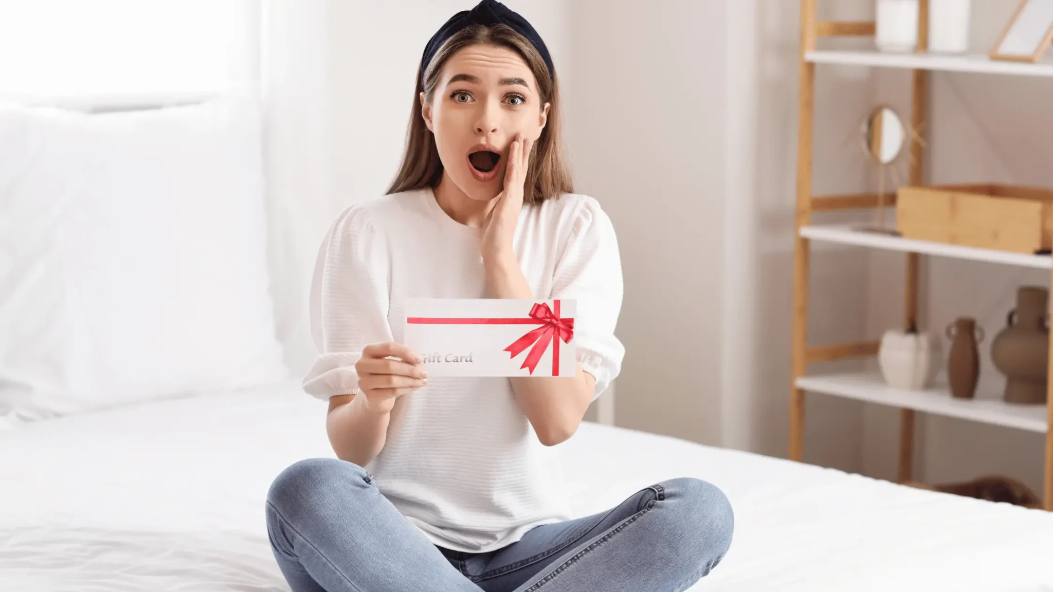 surprised lady holding a gift card